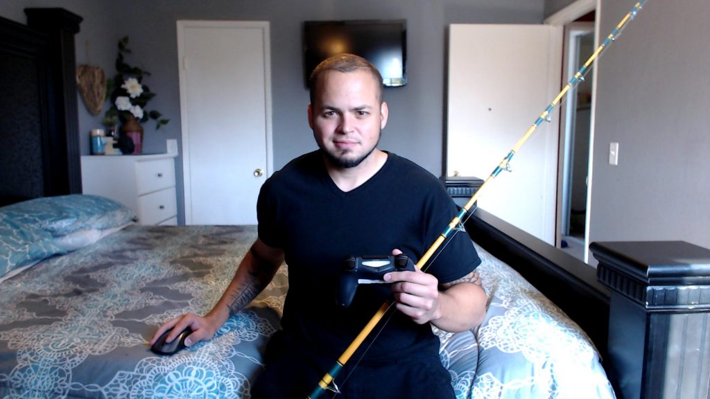 Picture of me with fishing rod and controller